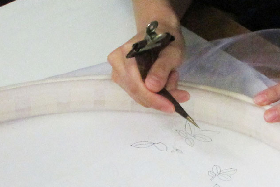 Tracing the design on the paper onto Super Organza, and line drawing with starch resist